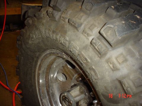 1983 Ford Bronco - A close-up view of a BellBoggger tire and wheel assembly, likely for an off-road vehicle.