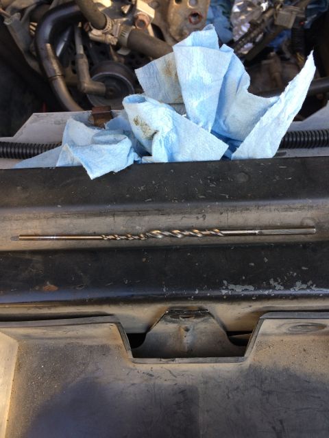 1989 Ford Bronco - A close-up view of an engine bay shows a dipstick and used paper towels.