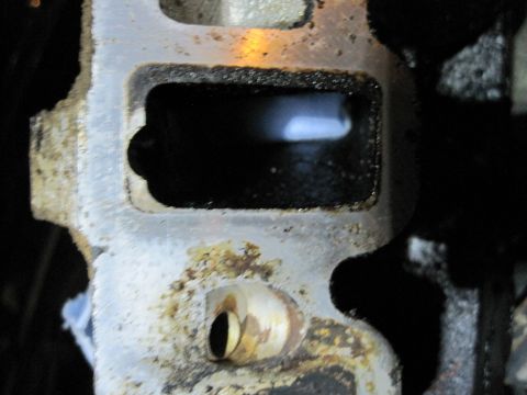 1989 Ford Bronco - Engine intake manifold part showing internal passage and mounting holes.