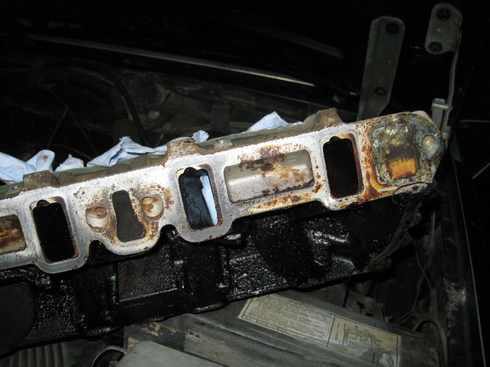 Engine intake manifold with rust and grime