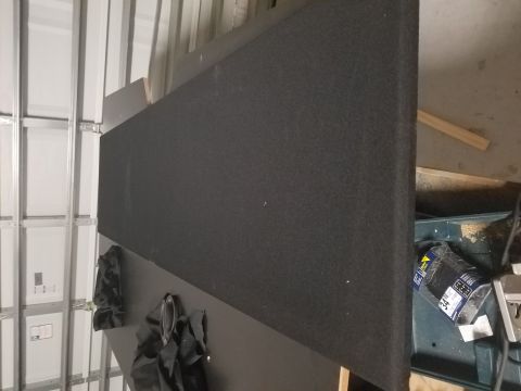 1994 Ford Bronco - A large black speaker box is shown in a workshop setting.