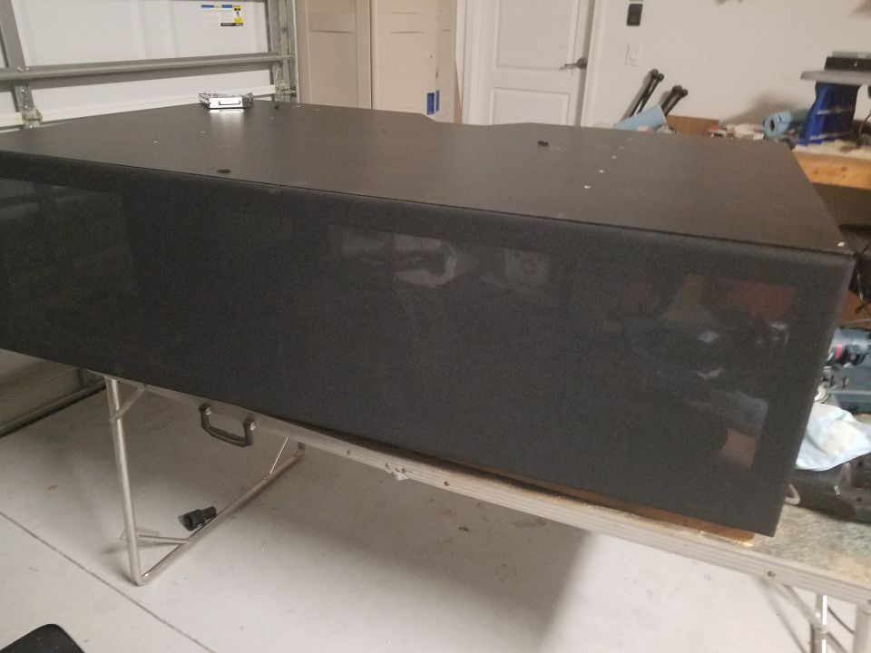 Black speaker box on a folding table