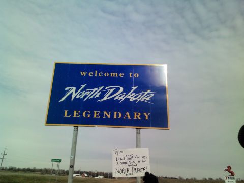 1971 Arctic Cat Panther 440 2-Pass - Welcome to North Dakota sign with a handwritten note attached to the pole.