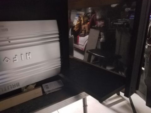 1994 Ford Bronco - A silver car stereo amplifier with "BRUTE" and "HIF" visible is shown in this image.