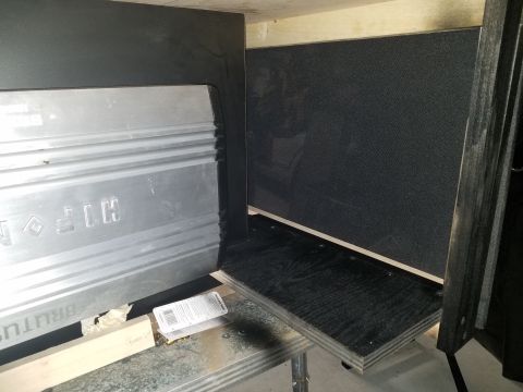 1994 Ford Bronco - Close-up of a Brutus car stereo amplifier installed in a custom enclosure.