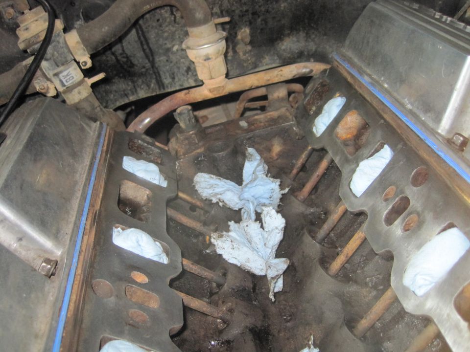 Engine block with rags stuffed into cylinders