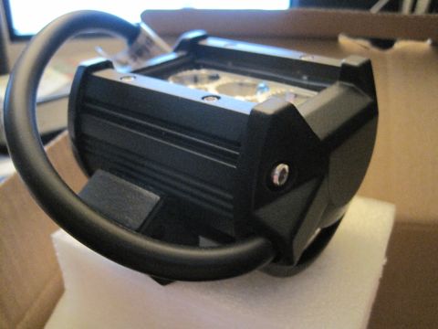 1989 Ford Bronco - A close-up view of a black LED light bar, likely for off-road vehicle use, sits on protective foam.