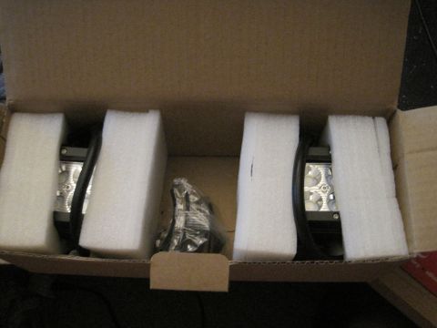 1989 Ford Bronco - Two LED light bars are packaged in a cardboard box with protective foam inserts.
