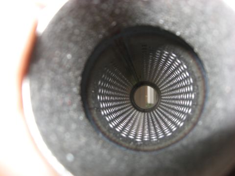 1987 Jaguar XJ6 - View through the perforated interior of a vehicle's exhaust pipe.