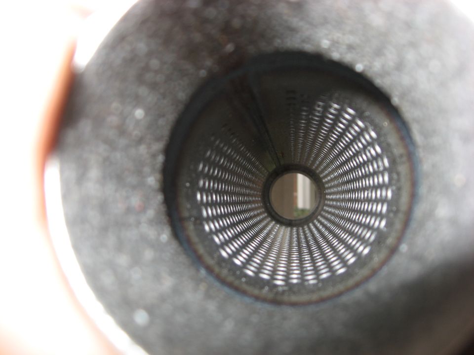 Inside of an exhaust pipe with a perforated metal baffle