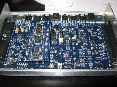 1987 Jaguar XJ6 - Close-up view of a complex electronic circuit board multiple microchips, transistors, and connectors, with some labels indicating CAN bus c…