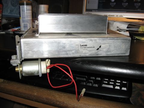 1987 Jaguar XJ6 - A Lucas 5cu fuel control unit is shown with attached wiring, resting on a computer keyboard.