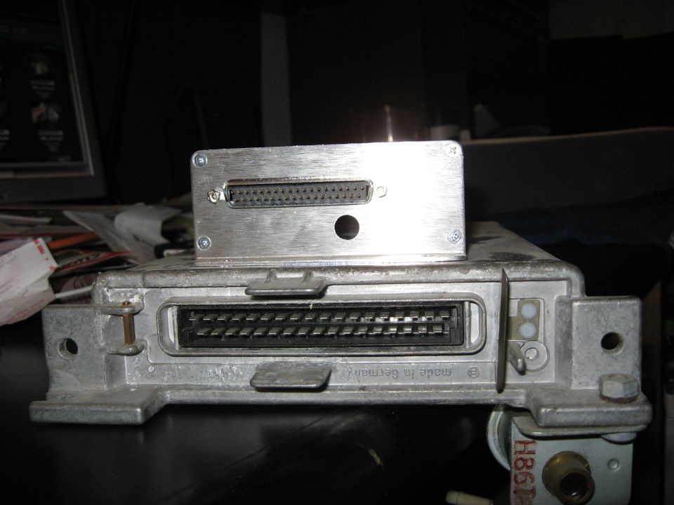 Engine control unit with two connectors and a smaller metal box on top