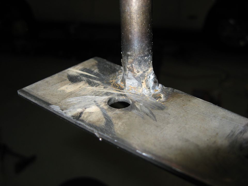 Welded metal plate with a hole