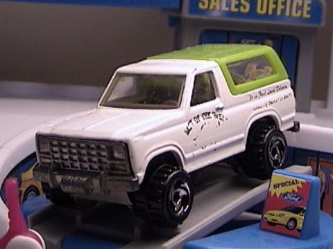 1979 Ford Bronco - This 1979 Ford Bronco toy features a white body with a green roof and "Best of the Best" text on the door.