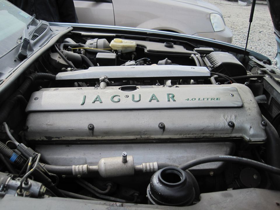 Jaguar XJ6 engine bay with 4.0 LITRE engine cover.