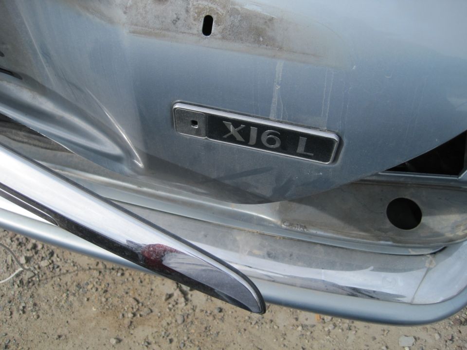 Light blue Jaguar XJ6 L rear with chrome bumper and XJ6 L badge