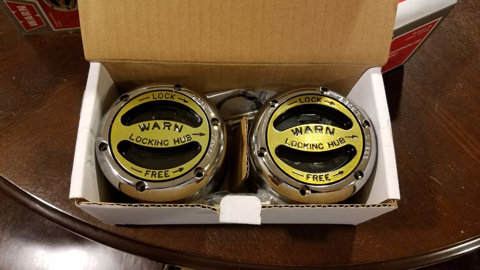 Pair of WARN locking hubs in packaging.