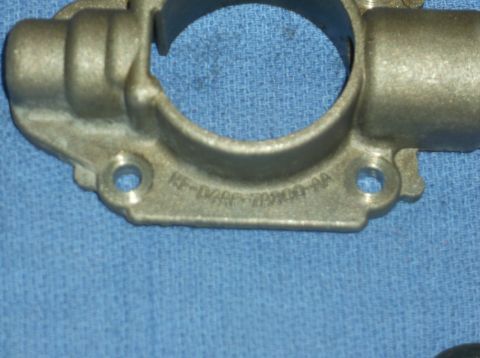 1979 Ford Ranchero - A metal automotive part is shown with stamped text, including a part number and website.