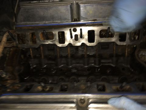 1989 Ford Bronco - Close-up view of an engine's intake manifold and cylinder head during a build or repair.