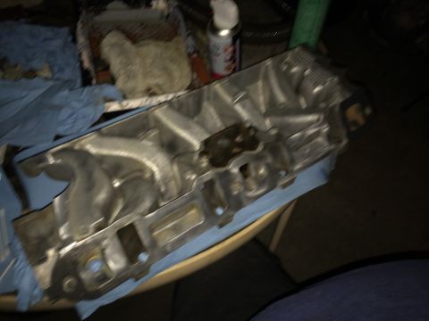 1989 Ford Bronco - An engine intake manifold is shown, not a complete vehicle.