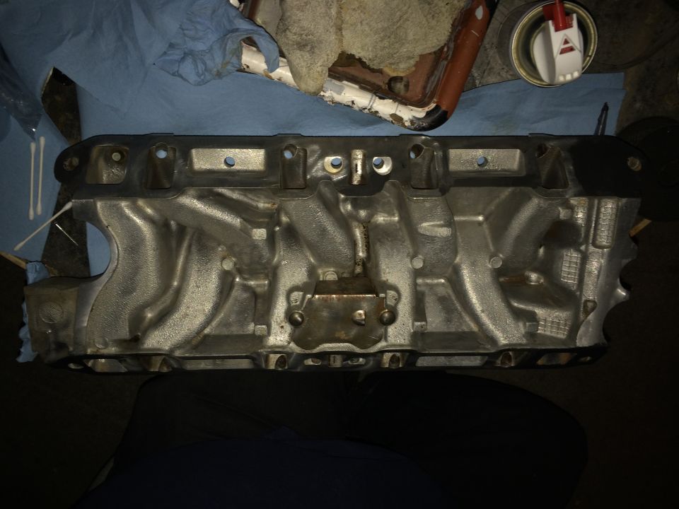 Engine intake manifold with silver finish and black gasket surface