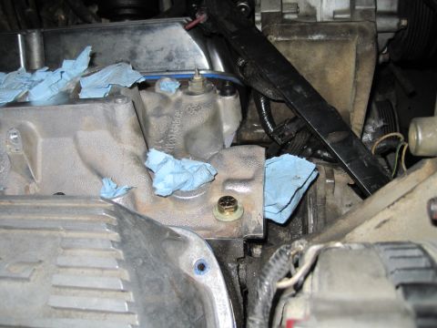 1989 Ford Bronco - Engine components are visible, with blue towels covering ports on the intake manifold.