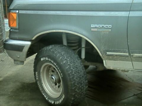 1989 Ford Bronco - Close-up of the front fender and wheel well of a 1989 Ford Bronco.