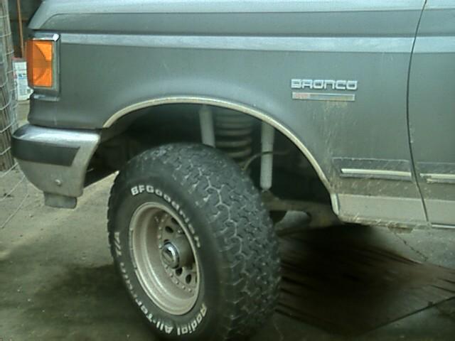 Side view of a 1989 Ford Bronco fender and large off-road tire