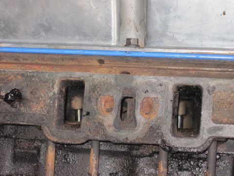 1989 Ford Bronco - Engine cylinder head ports showing internal components and signs of wear.