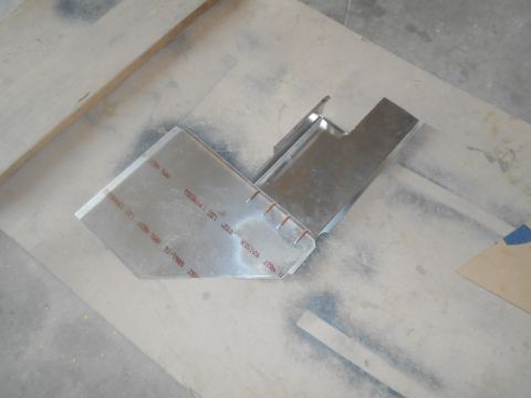 1992 Ford Bronco - A metal bracket with red text indicating 'KAISER' and a date range of '91-1992' is shown on a flat surface.