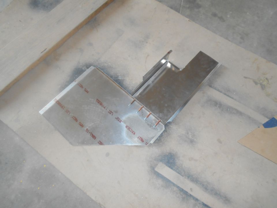 metal bracket with red markings that include 'KAISER' and '91-1992'