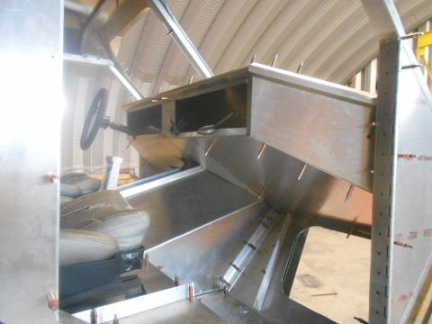 1992 Ford Bronco - Unfinished interior of a custom vehicle build, bare metal construction and seats.