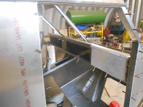 1992 Ford Bronco - This is a view of an unfinished vehicle's interior structure, made of aluminum, with some seating components.