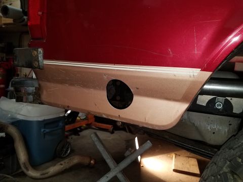 1995 Ford Bronco - Lower body panel of a 1995 Ford Bronco, showing the fuel door opening.