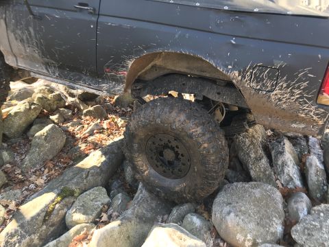 1989 Ford Bronco - This 1989 Ford Bronco is shown off-roading over a pile of rocks.