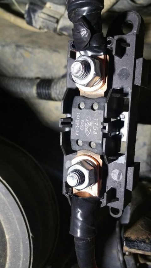 1996 Ford Bronco - Close-up of a Ford alternator fuse holder, showing its amperage rating and part number.