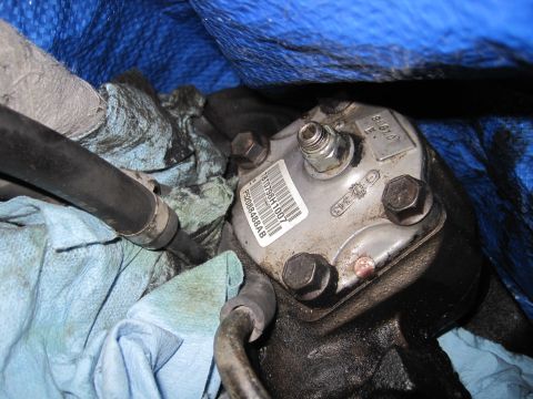 1994 Cadillac Fleetwood - Close-up of a steering box, possibly for a Jeep, with a visible part number label.