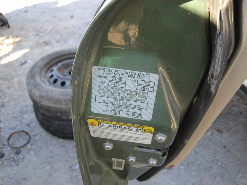 Green Jaguar door jamb sticker with manufacturing date 03/99