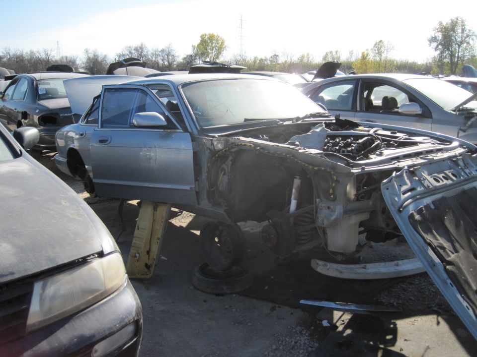 1985 Jaguar XJ6 in junkyard, front end removed, side view