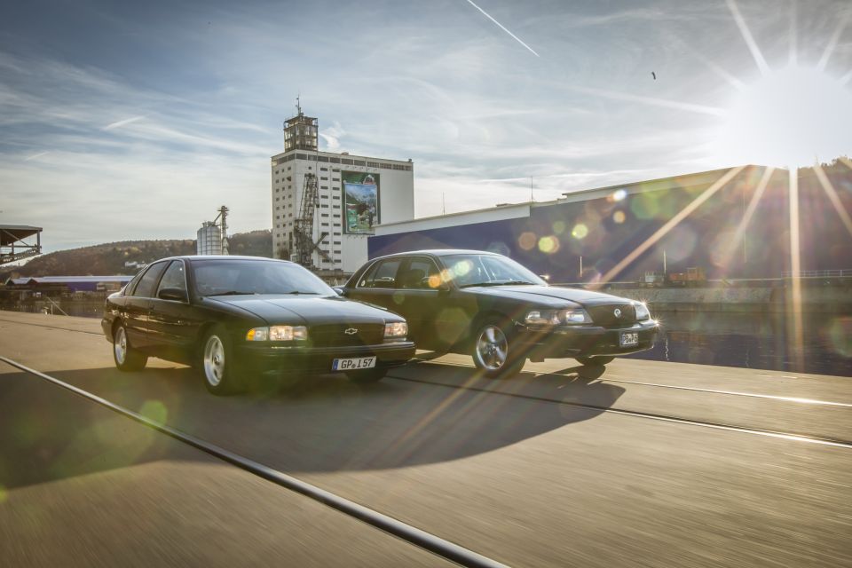 2003 Mercury Marauder and Chevrolet Impala driving side-by-side