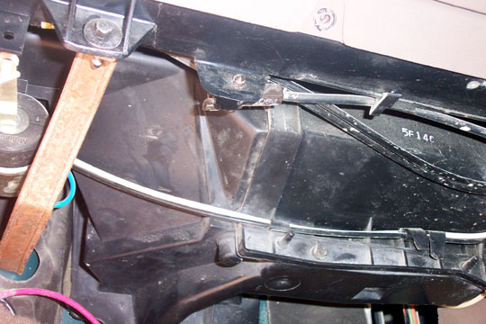 Black plastic HVAC heater box duct assembly under vehicle dash marked 5F140