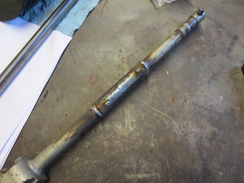 1967 Ford F-250 - A close-up view of a metal steering column part that has been welded.