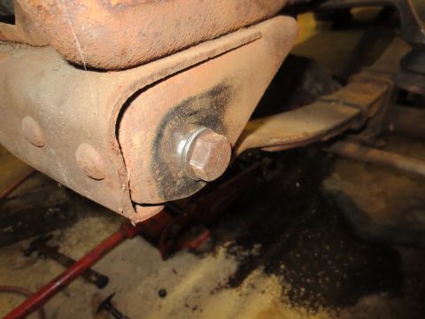 1967 Ford F-250 - Rusty truck suspension component, possibly from a Ford F-250, undergoing maintenance.
