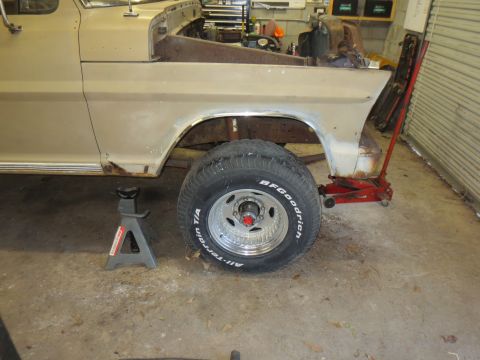 1967 Ford F-250 - This truck is in a garage, possibly undergoing repairs or restoration, with the front end raised on jack stands.