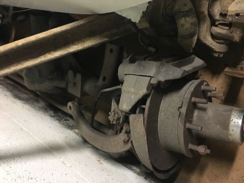 1967 Ford F-250 - This image shows a close-up view of a vehicle's axle and brake assembly, likely from a truck.