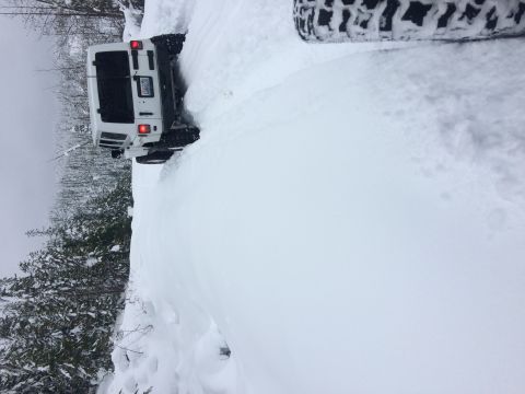1995 Jeep Wrangler - Jeep Wrangler driving through deep snow on a trail.