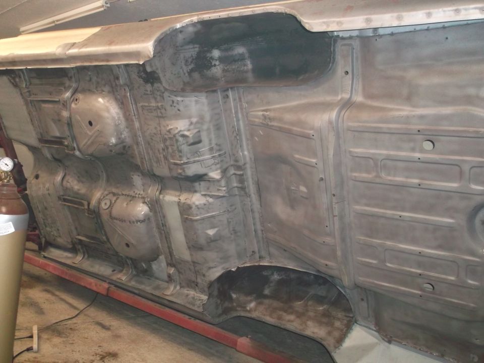 Underside of a 1964 Ford Galaxie, showing the floor pan and frame rails