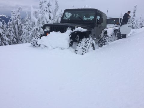 1995 Jeep Wrangler - Two Jeeps buried in snow during a winter run.