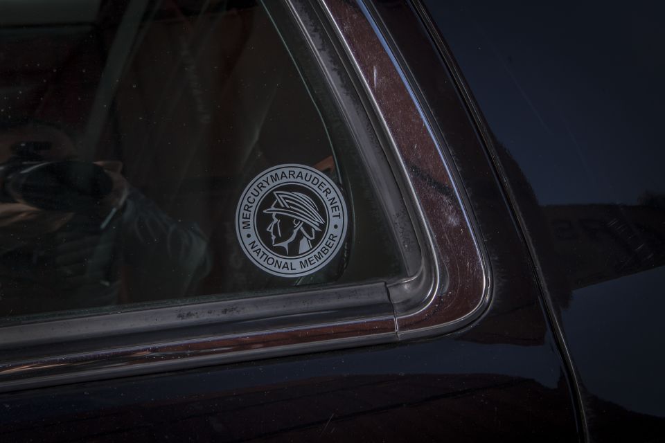 Close-up of a Mercury Marauder National Member sticker on a car window.